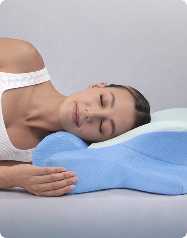 Side sleeping position with an arm resting through the pillow's support channel